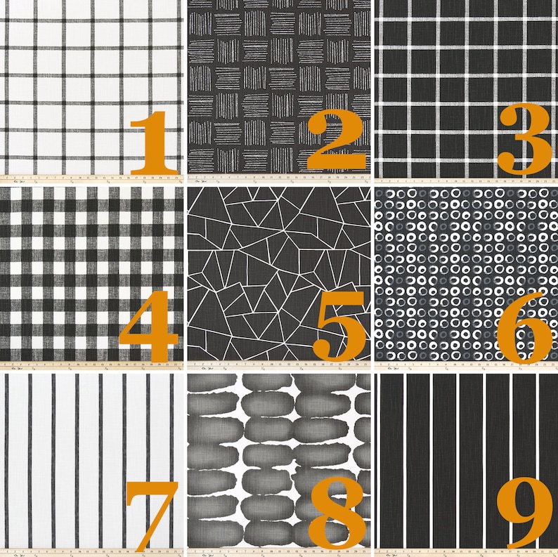 May include: A collection of nine fabric swatches featuring black and white patterns including grids, geometric shapes, circles, and stripes. Each swatch is numbered 1 through 9, with a visible ruler at the bottom showing measurements in centimetres.