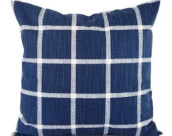 May include: A blue and white checkered throw pillow with a soft, textured fabric.