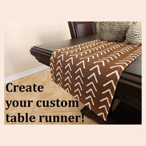 May include: A brown and white table runner with a chevron pattern. The text "Create your custom table runner!" is visible in the image.