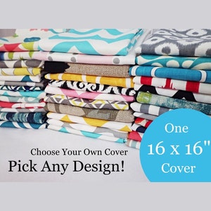 May include: A stack of colorful fabric swatches in various patterns, including geometric, floral, and abstract designs. Choose your own cover, pick any design! One 16 x 16' cover.