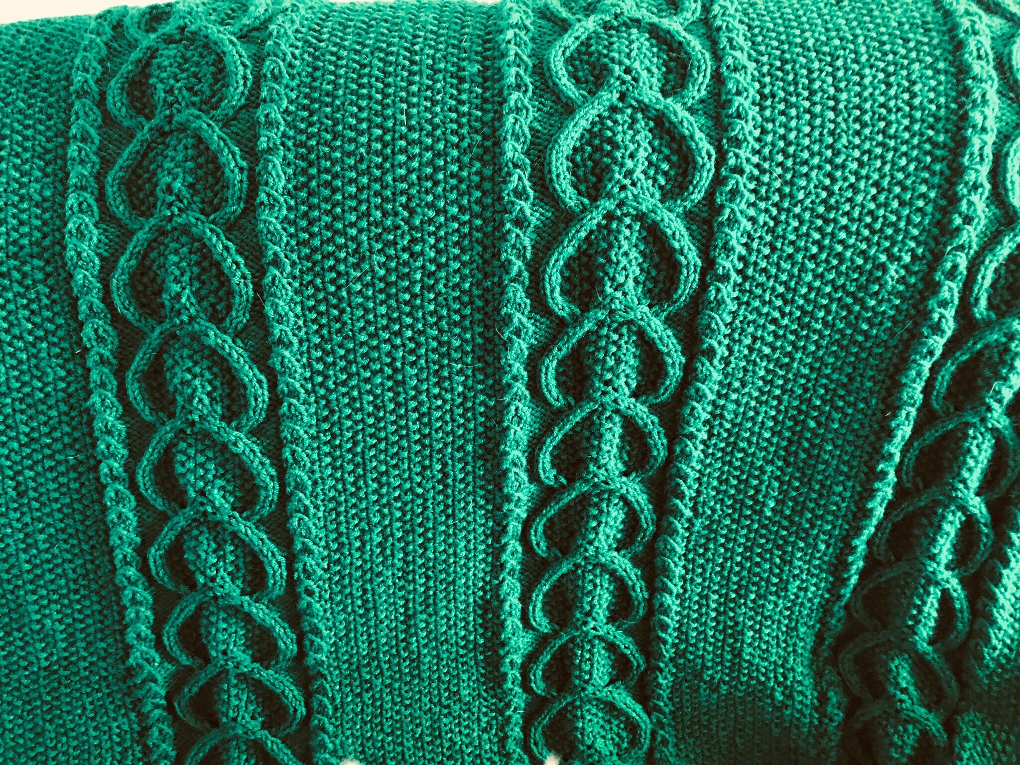 Green cable knitted blanket
