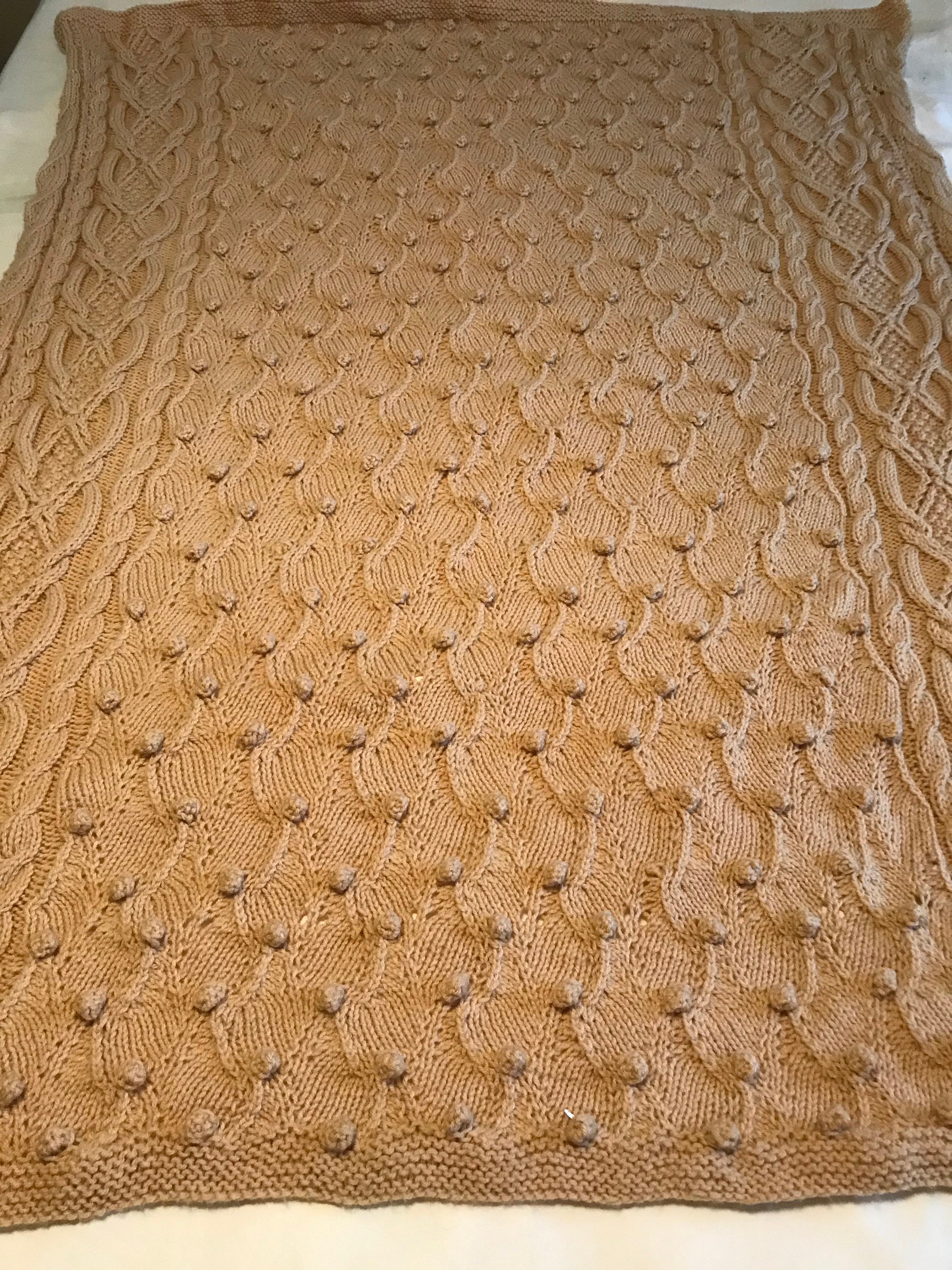 Knitted cable throw