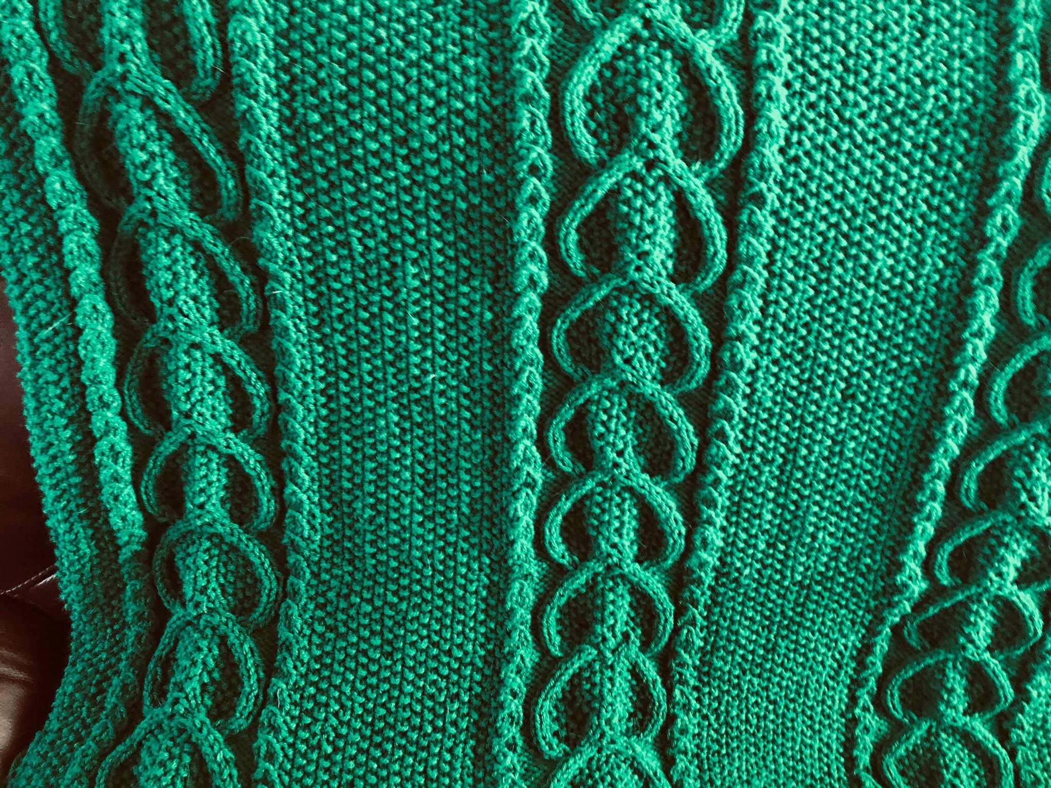 Green cable knitted blanket