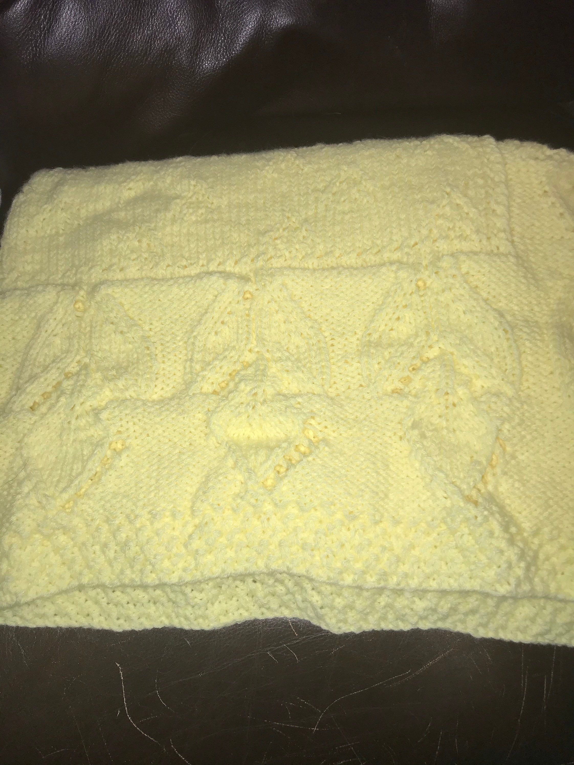 Bright yellow baby boy or girl blanket in soft fingering baby yarn.