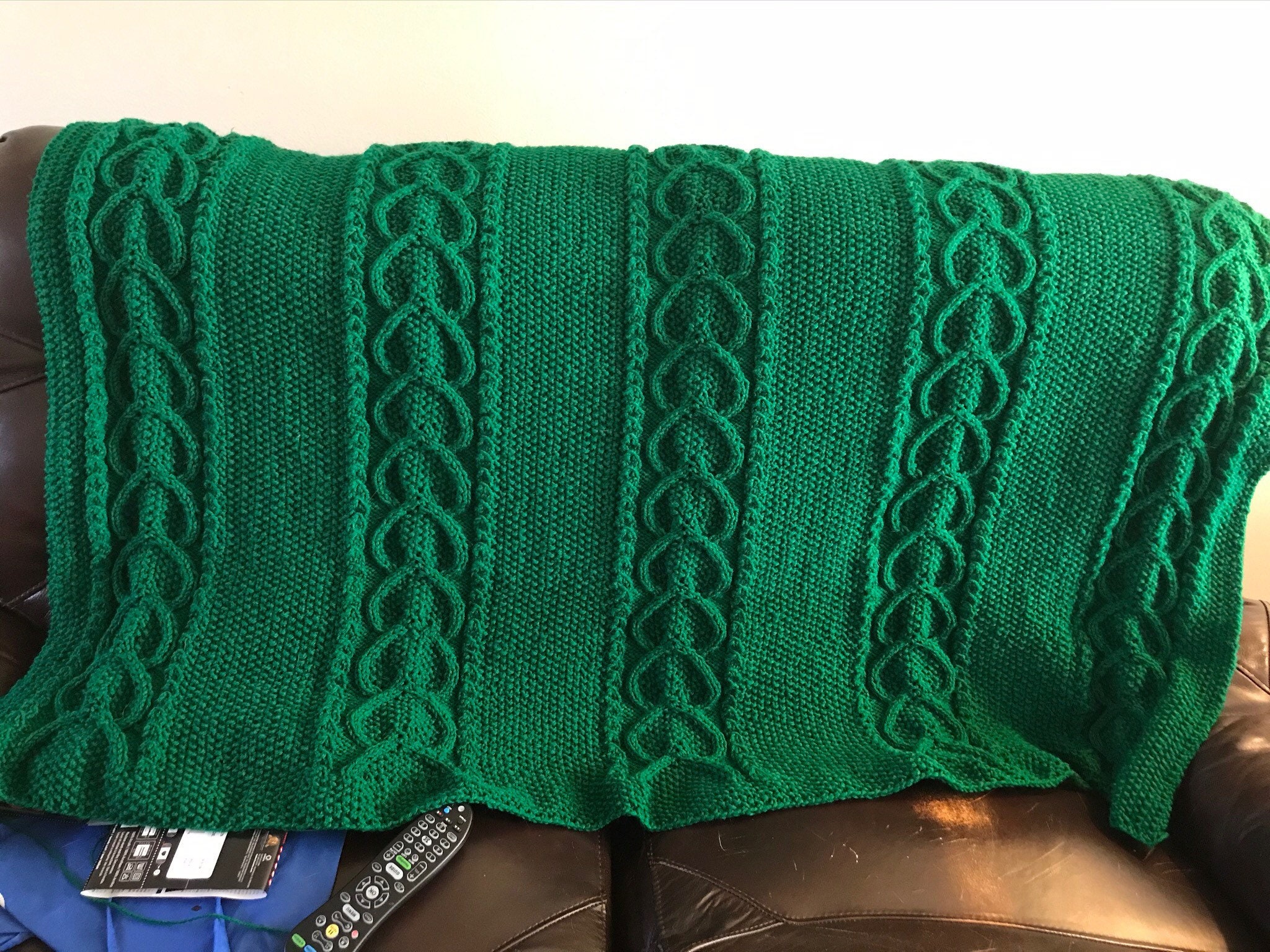 Green cable knitted blanket