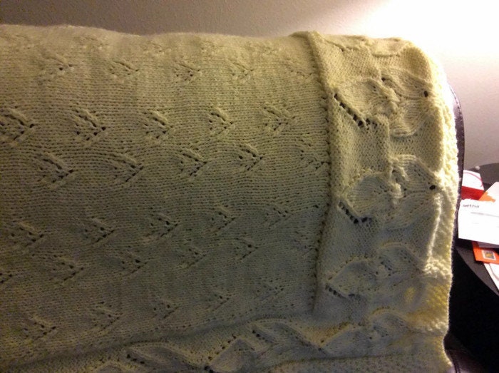 Bright yellow baby boy or girl blanket in soft fingering baby yarn.