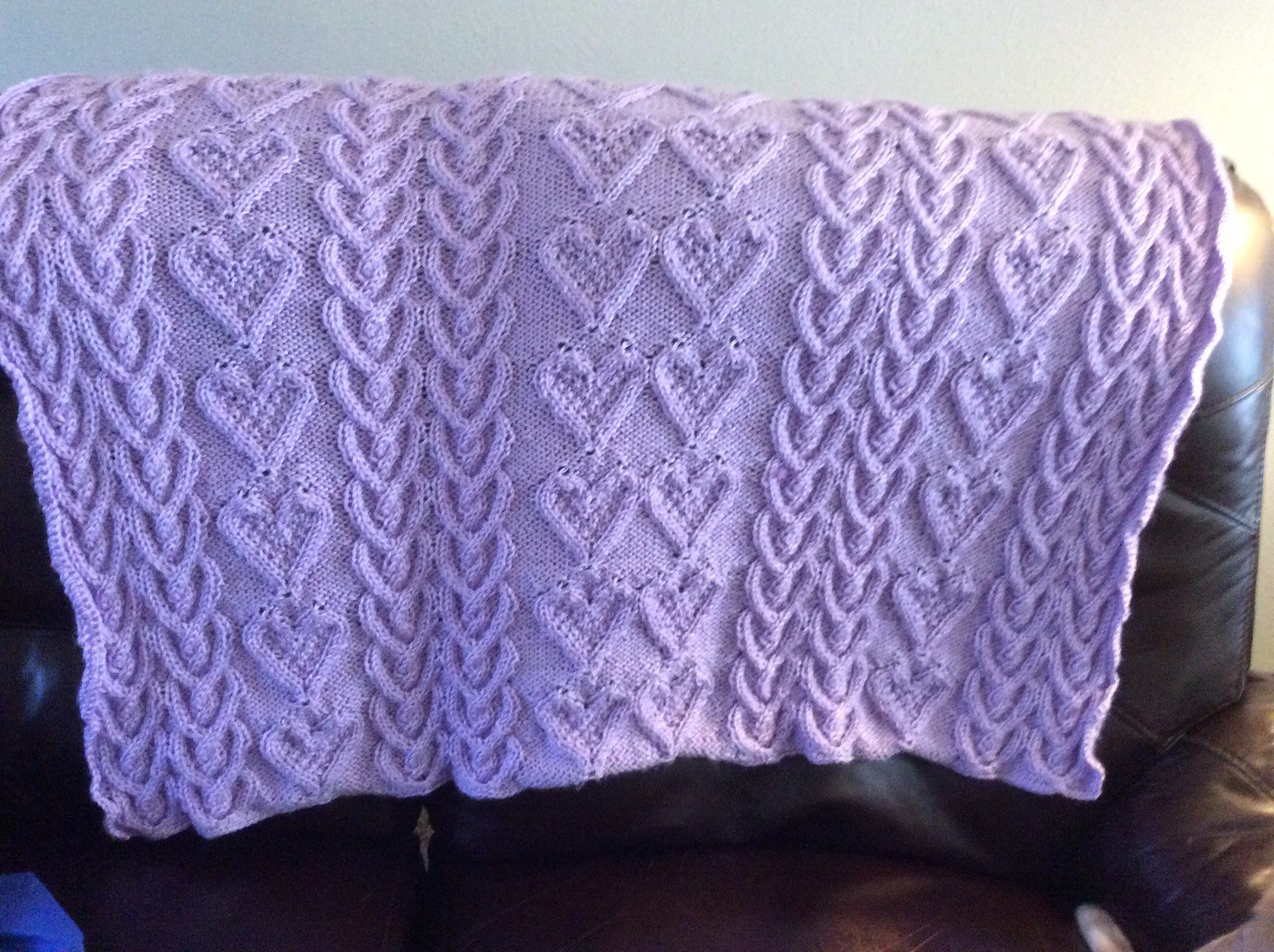 Baby blanket in soft and warm Caron Simply Soft yarn in color called Orchid