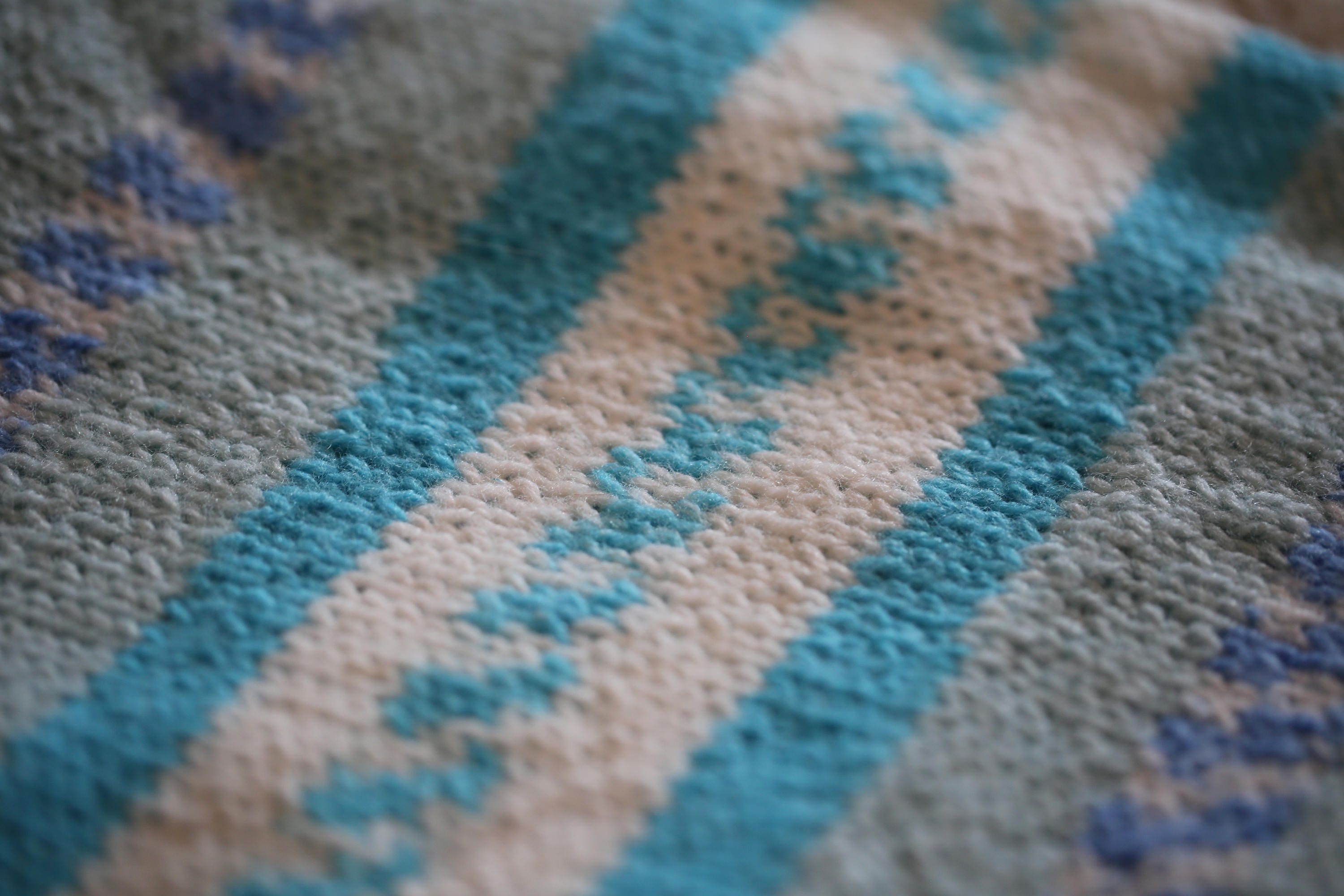 Baby blanket in soft acrylic yarn in shades of blue and white