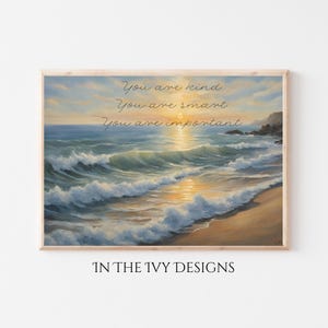 Può includere: Una stampa artistica rettangolare da parete con un dipinto a olio di un tramonto costiero con onde che si infrangono, una spiaggia sabbiosa e scogliere rocciose. Il testo "You are kind, You are smart, You are important" è in corsivo nero.