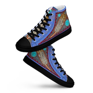 May include: High-top sneakers with a blue canvas upper featuring a colorful pattern of feathers and turquoise accents. The shoes have black laces and a black rubber sole.