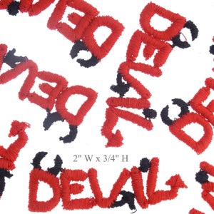 May include: Red embroidered iron-on patches that spell out "DEVIL" with black horns. The patches are 2 inches wide and 3/4 inches high.