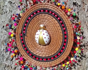 310 Ruby the Ladyfly Coiled Pine Needle Wall Hanging