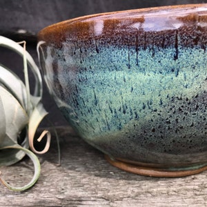 Pottery fruit bowl in turquoise green
