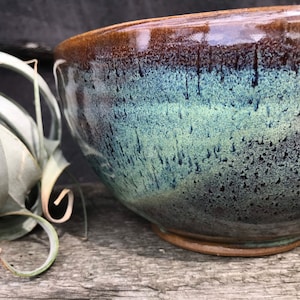 Pottery fruit bowl in turquoise green