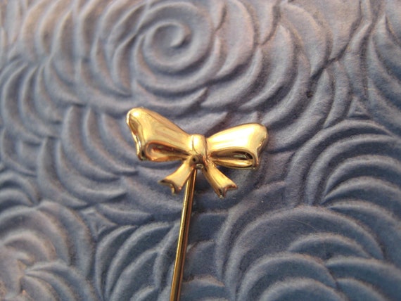 Tiny Gold Tone Bow Stick Pin - image 1