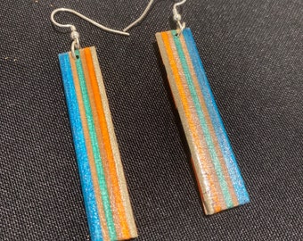 Upcycled skateboard earrings recycled by Duque Skate Art