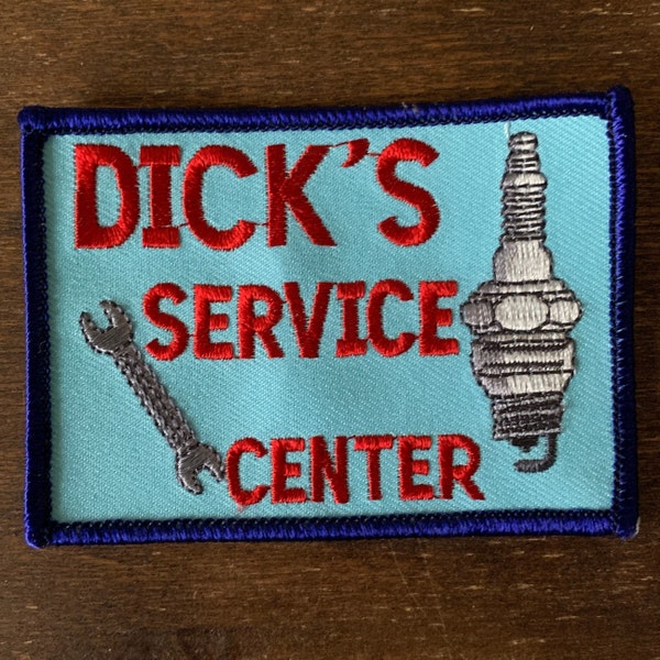Dick's Service Center. A blue work shirt uniform patch with red print