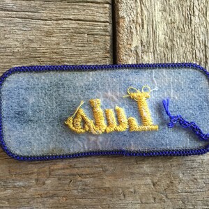 Luis. A royal blue work shirt patch that says Luis in yellow script image 3