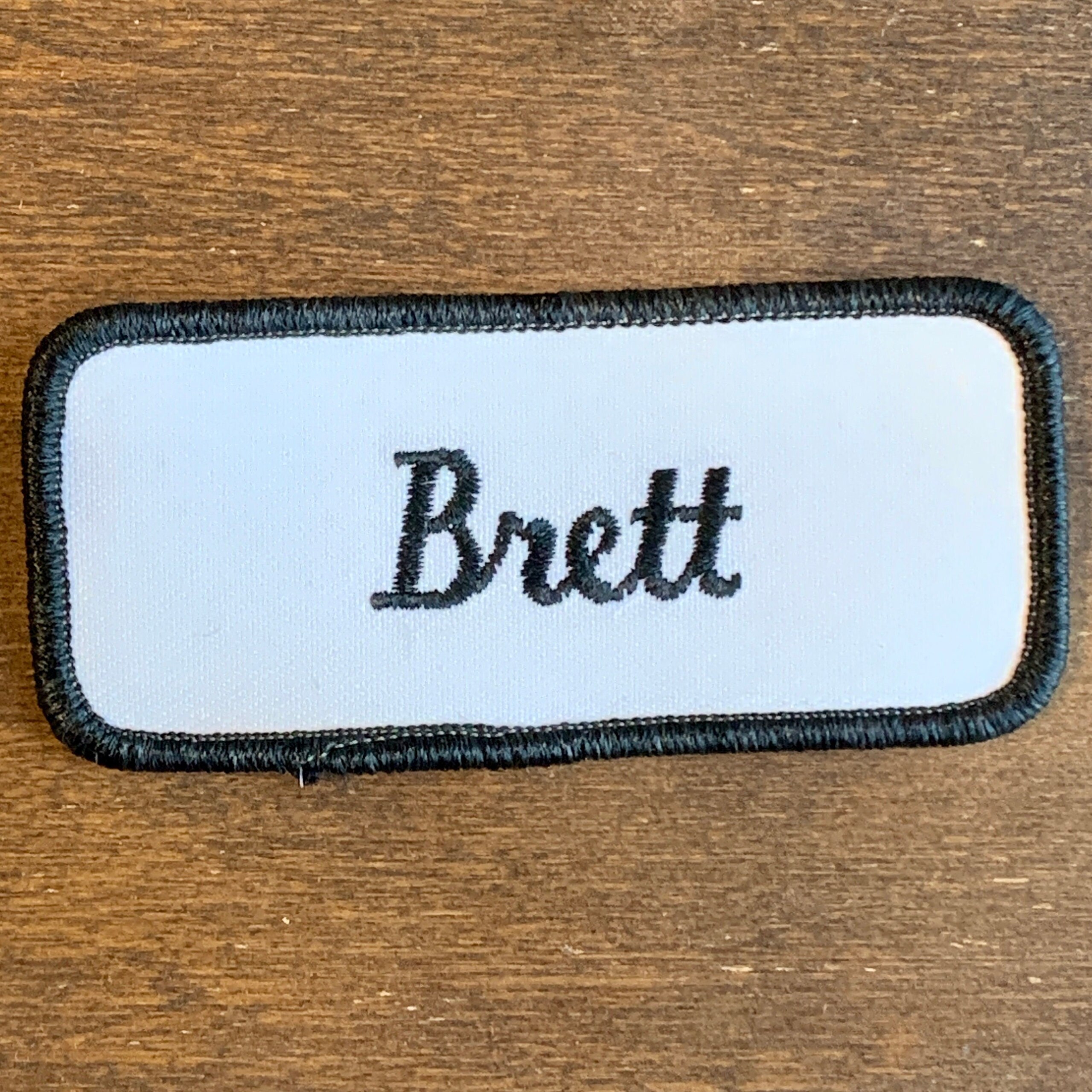 Black Iron-on Name Patch on Gray Background Vintage