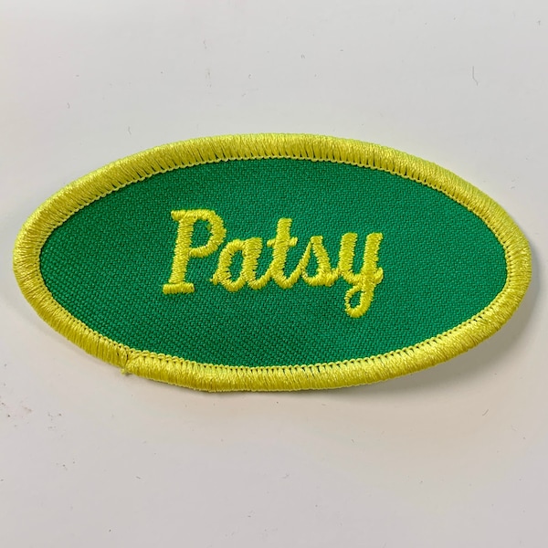 Patsy. A green work shirt patch that says "Patsy" in yellow script with yellow border.