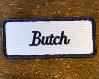 Butch. A white work shirt patch that says "Butch" in blue print with blue border