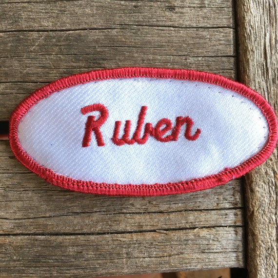 Ruben. A white work shirt patch that says "Ruben"