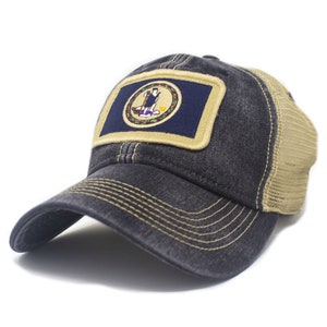May include: A black and tan trucker hat with a vintage look. The hat features a patch with the Virginia state flag.