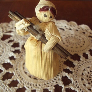 Vintage Czechoslovakian hand made corn husk doll little lady carrying sticks