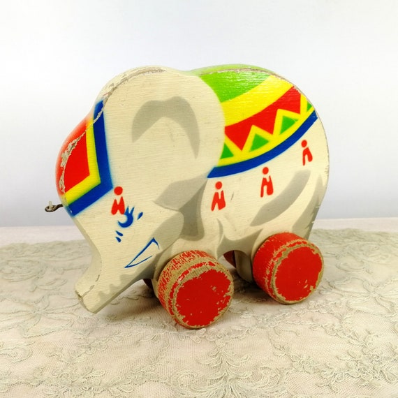 1910 stuffed elephant on wheels