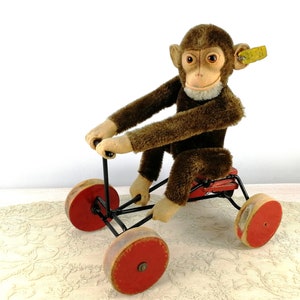 Steiff Mohair Monkey with IDs sitting on Carriage vintage 1949 to 1957 produced so called Record Peter