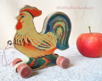 Vintage wooden pull toy rooster on wheels, small colourful old pull along animal, dolls or teddy bears accessory, made in 1930s Germany