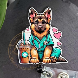 May include: A badge reel with a cartoon German Shepherd wearing teal scrubs and a stethoscope, with a coffee drink and pink hearts. The reel has a clear plastic holder and a black retractable cord. The design is a cartoon style.