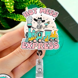 May include: A colorful badge reel with a skeleton riding a train with the text "Hot Mess Express".