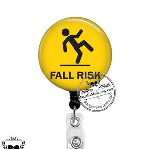 May include: Yellow round badge holder with a black stick figure falling and the text "FALL RISK".