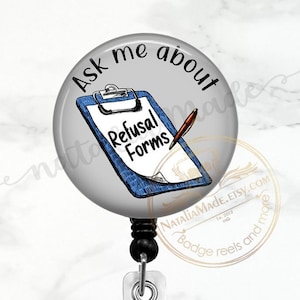 May include: A white button with a black border and the text "Ask me about Refusal Forms" in black. The button features a blue clipboard with a white sheet of paper and a pen. The button is attached to a black and silver retractable badge reel.