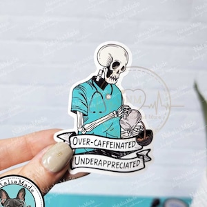 May include: A 3" x 2.3" waterproof sticker featuring a skeleton wearing a blue medical scrubs and a stethoscope, pouring coffee from a coffee pot. The sticker has the text "Over-caffeinated Underappreciated".