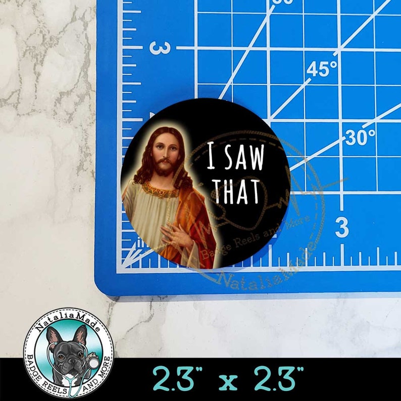 May include: A 2.3 inch diameter button with a black background and a picture of Jesus. The text "I SAW THAT" is written in white letters below Jesus.