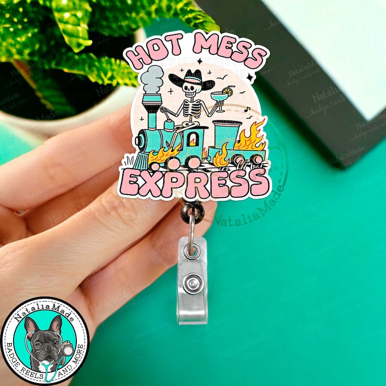 May include: A colorful badge reel with a skeleton riding a train with the text "Hot Mess Express".