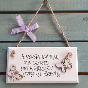 Handmade shabby chic wooden plaque handwritten with an inspirational quote - A moment lasts all of a second ...
