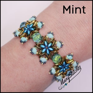 May include: A beaded bracelet with a mint green, gold, and blue color scheme. The bracelet features a repeating pattern of flower-shaped beads. The text "Mint" is visible in the upper right corner of the image. The text "Many Stitches" is visible in the lower right corner of the image.
