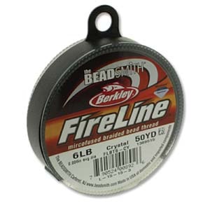 May include: A spool of Berkley FireLine mircofused braided bead thread in a black plastic container. The spool is labeled with the text "FireLine", "mircofused braided bead thread", "Crystal", "50YD", "6LB", "FLST6-CY", and a barcode.