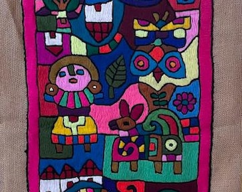 Handmade Ecuadorian embroidery fiber art. Textile art. Fabric art.