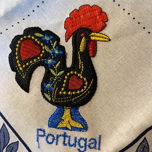 Cotton Portuguese tea towel printed with traditional blue & white azulejos edge patterns and embroidered rooster