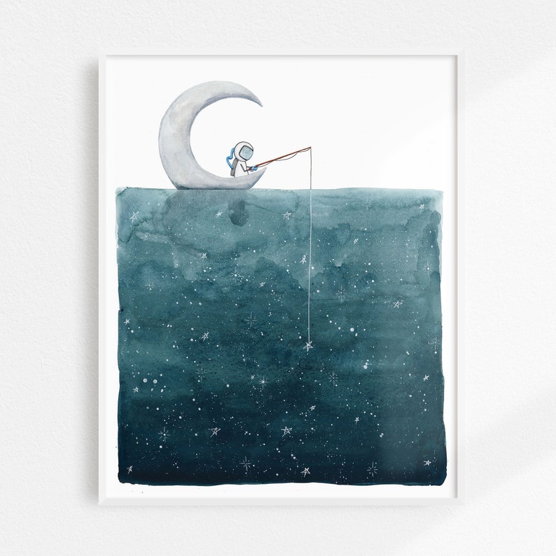 May include: A watercolor illustration of an astronaut fishing from a crescent moon in a dark blue sky filled with white stars.