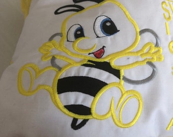 A  bumble bee  reading pillow with a pocket for a book... travel pillow