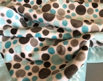 A aqua , gray and white polka dot print in minky, the back is a aqua minky dot.