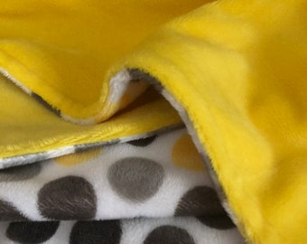 A yellow, gray and white polka dot print in minky, the back is a bright yellow shannon minky plush.