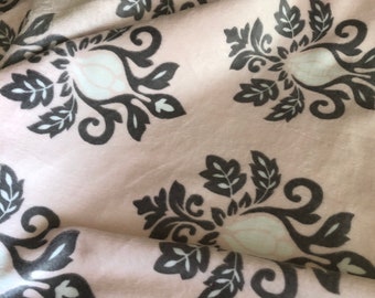 A PInk, gray and white print in minky, the back is a white minky MInky dOt, With a white SAtin BInding