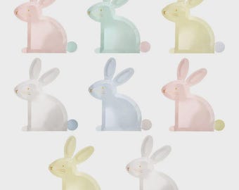May include: A set of eight rabbit-shaped paper plates in pastel colors including pink, mint green, yellow, white, and light blue. Each plate features a simple gold foil outline of a bunny profile with a small circular tail accent.
