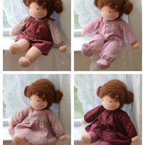 May include: Four handmade cloth dolls with brown hair and different outfits. The dolls are sitting on a windowsill with white lace curtains.